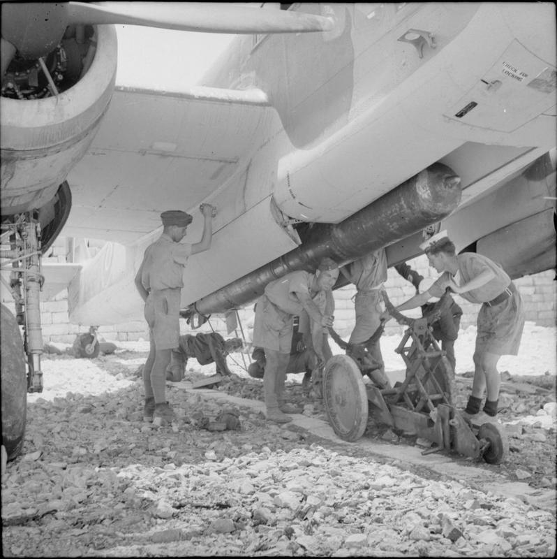 Ground crew at Luqa load a torpedo onto a Bristol Beaufort for a sortie against the Italian naval force threatening Operation Harpoon, June 1942.